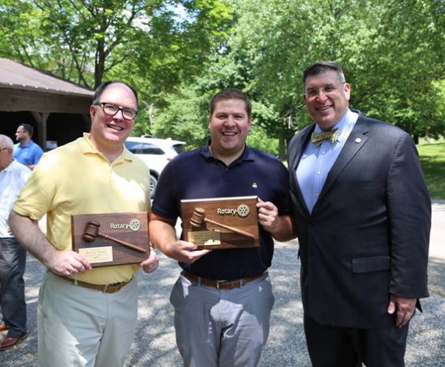 Past Rotary president Michael Hires and Daniel Young with 2021-2022 President Rabbi Joshua Lief.
